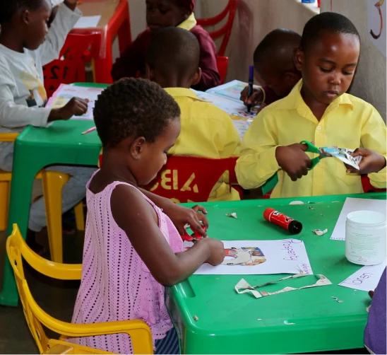 A young girl playing at a play table