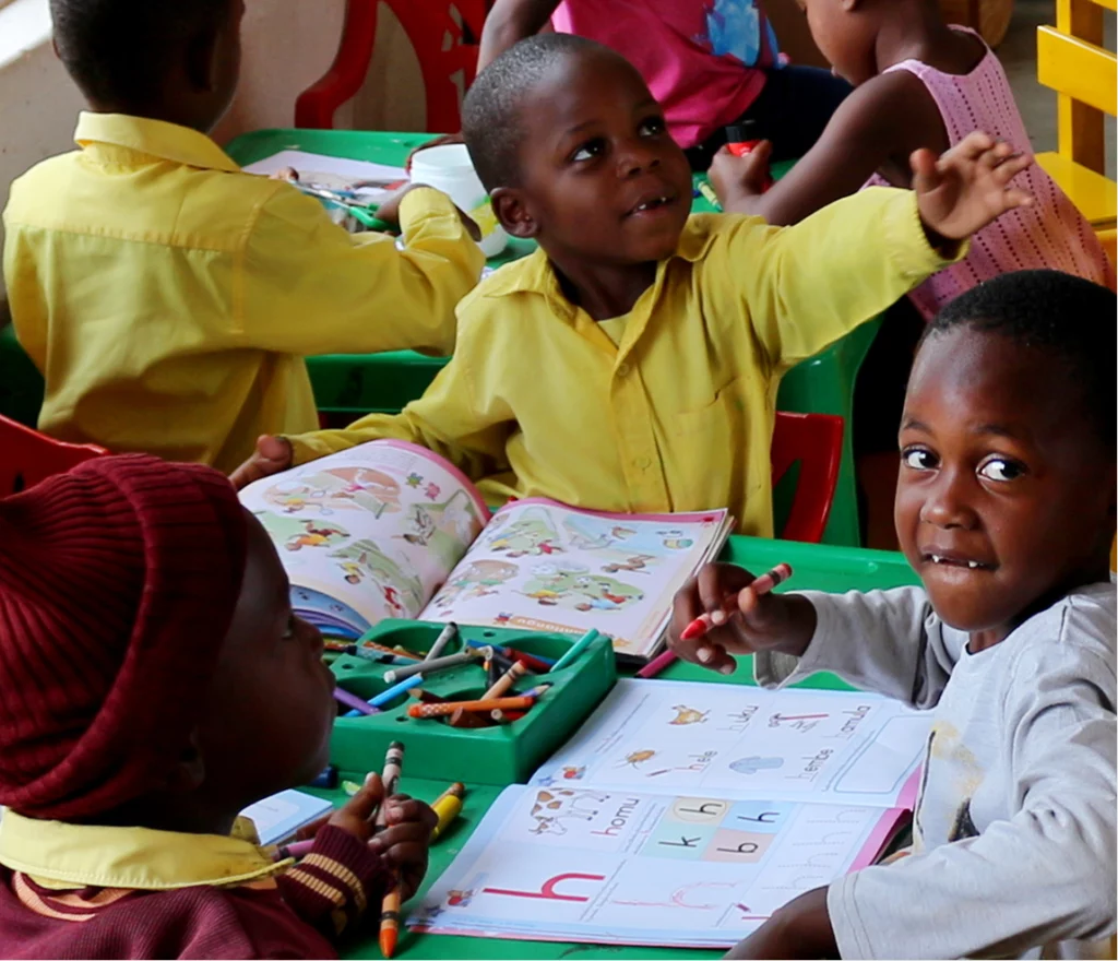 A group of young learners at a play table